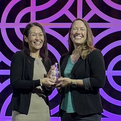 Receiving the CREW Network Impact Award on stage