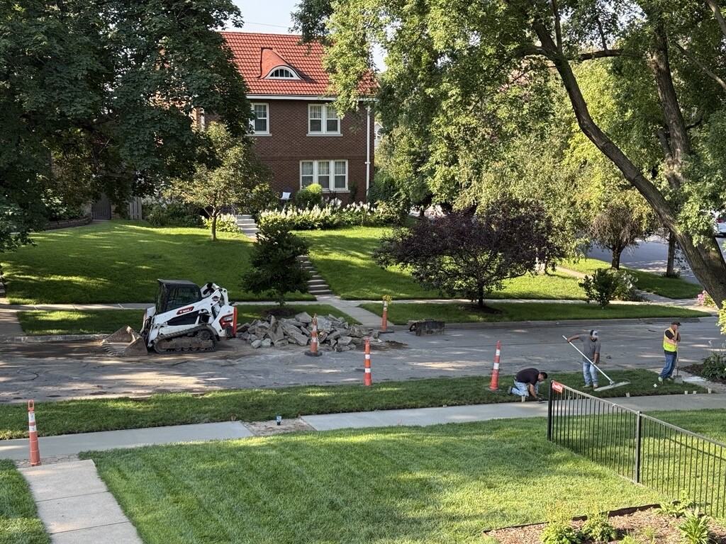 Replaced sidewalk (with the one panel that was allowed to remain)